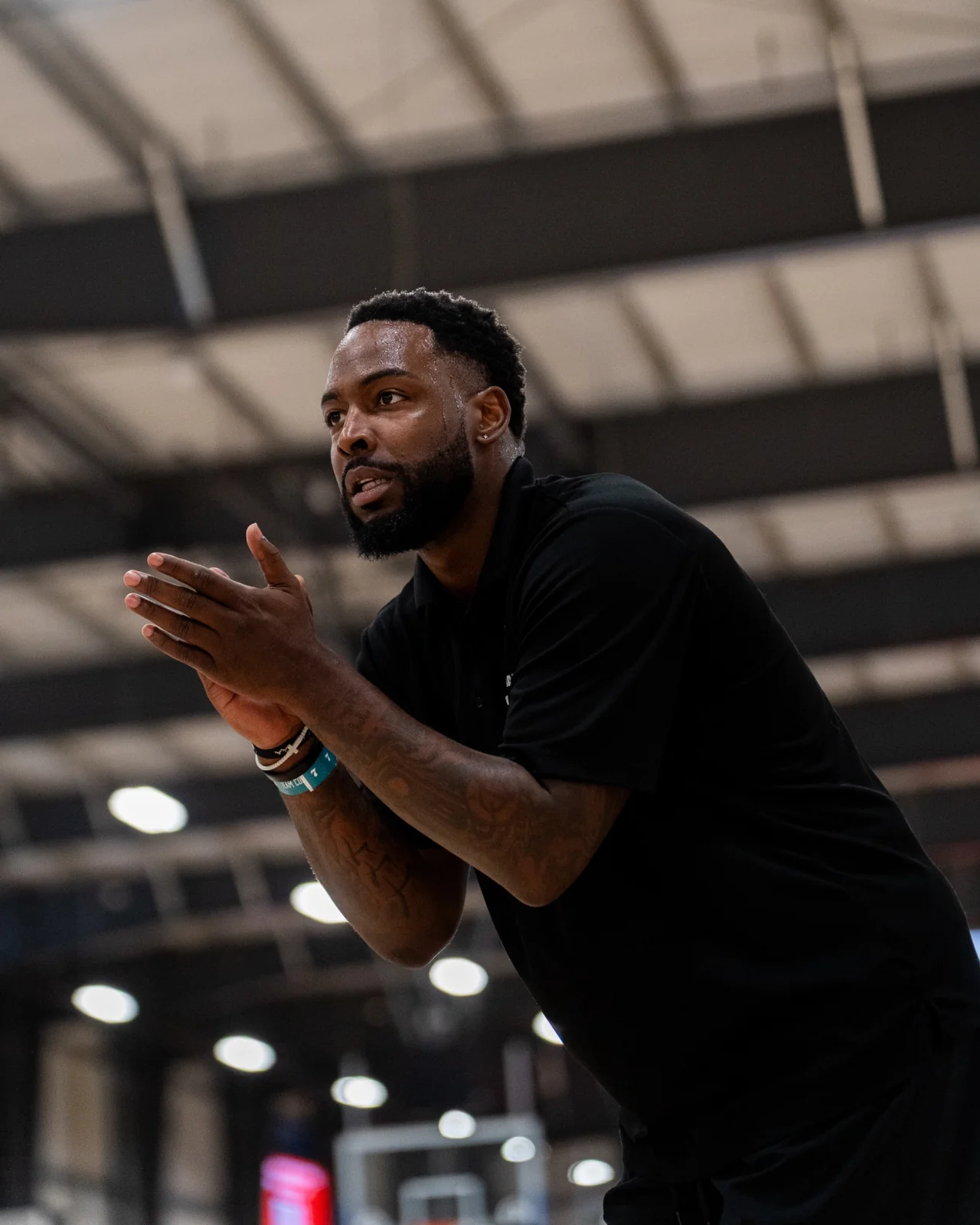 Basketball coach encouraging his players