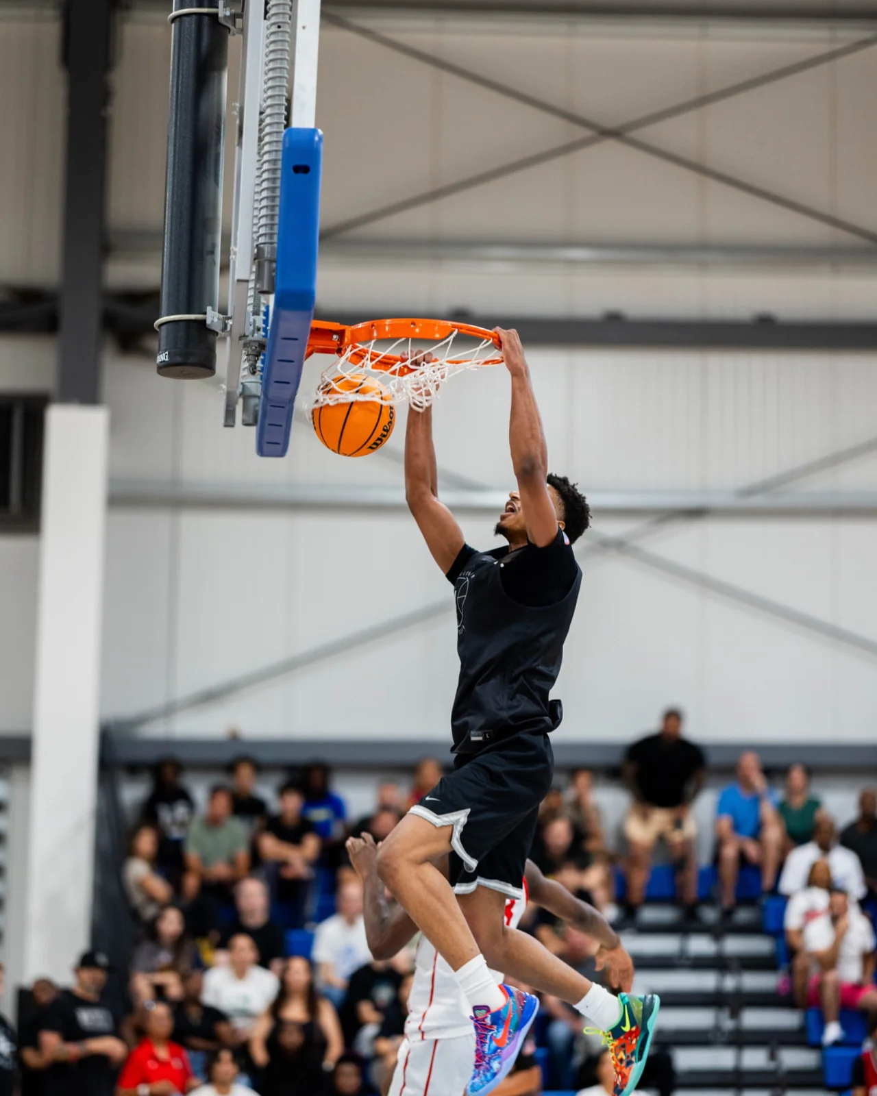 A player rises toward the basket at Section 7